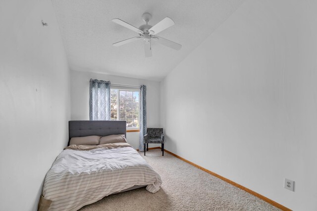 2225 Ranchview Ln N Unit 1, Plymouth, MN 55447 - carpeted bedroom featuring vaulted ceiling, baseboards, and ceiling fan