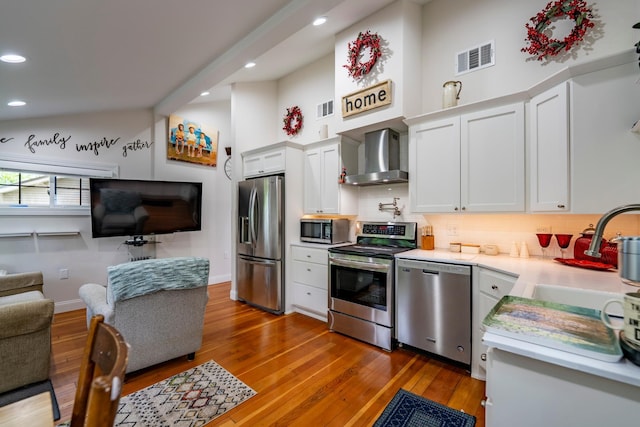 30124 Circle Dr, Breezy Point, MN 56472 - kitchen with stainless steel appliances, wall chimney range hood, light countertops, decorative backsplash, and a sink