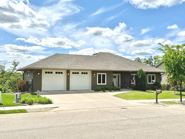 2774 Pine Ridge Blvd, Red Wing, MN 55066 - ranch-style home with a garage, concrete driveway, a front lawn, and a shingled roof