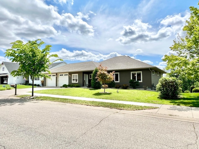 2774 Pine Ridge Blvd, Red Wing, MN 55066 - view of front of house featuring an attached garage, a front lawn, and concrete driveway