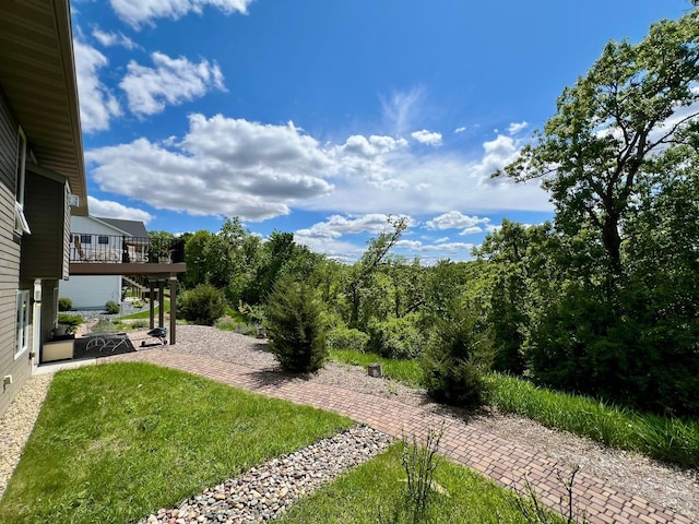 2774 Pine Ridge Blvd, Red Wing, MN 55066 - view of green lawn featuring a patio area and a wooden deck
