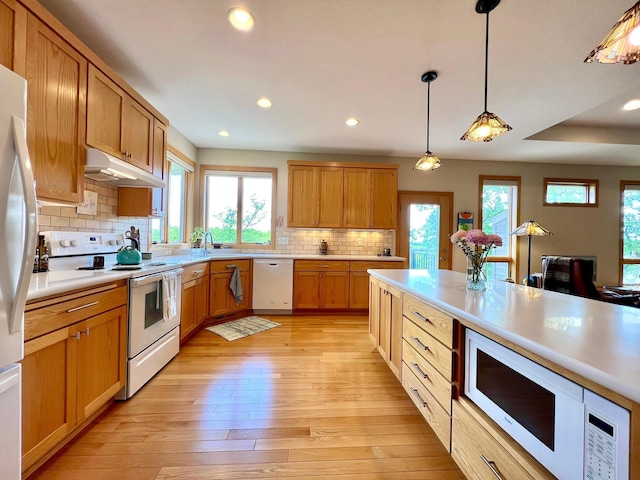 2774 Pine Ridge Blvd, Red Wing, MN 55066 - kitchen featuring white appliances, under cabinet range hood, plenty of natural light, light countertops, and recessed lighting