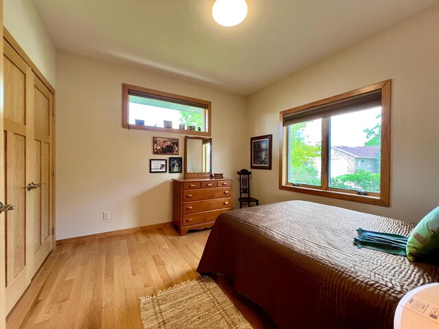 2774 Pine Ridge Blvd, Red Wing, MN 55066 - bedroom featuring light wood-style floors and baseboards