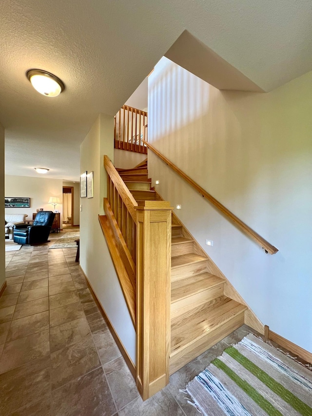 2774 Pine Ridge Blvd, Red Wing, MN 55066 - stairs with baseboards and a textured ceiling