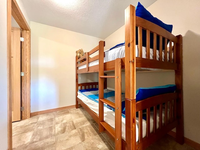 2774 Pine Ridge Blvd, Red Wing, MN 55066 - bedroom with a textured ceiling and baseboards