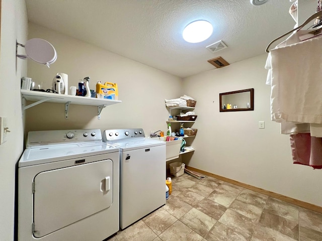 2774 Pine Ridge Blvd, Red Wing, MN 55066 - laundry room with washing machine and dryer, baseboards, and a textured ceiling