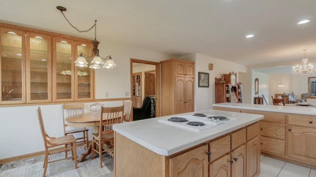 9020 120th Ave, Tilden Twp, WI 54724 - kitchen featuring a chandelier, white electric cooktop, light brown cabinets, light countertops, and a center island
