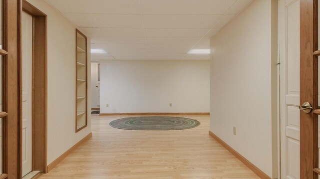 9020 120th Ave, Tilden Twp, WI 54724 - hall with a paneled ceiling, light wood-style floors, and baseboards