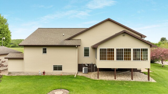9020 120th Ave, Tilden Twp, WI 54724 - back of house with a lawn, roof with shingles, and central AC unit
