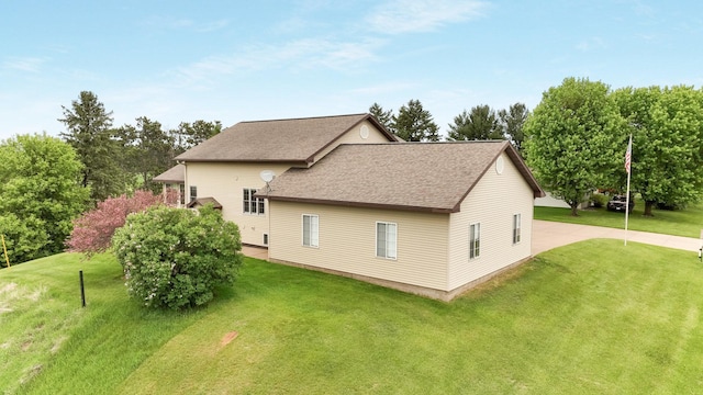 9020 120th Ave, Tilden Twp, WI 54724 - view of home's exterior featuring a shingled roof and a yard