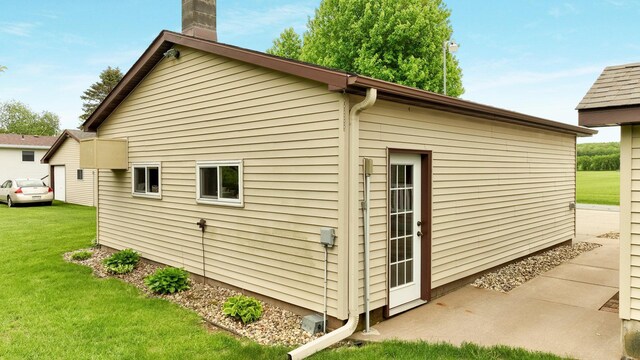 9020 120th Ave, Tilden Twp, WI 54724 - view of side of home featuring a lawn and a chimney