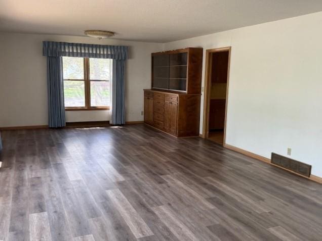 510 2nd Ave NW, Milaca, MN 56353 - empty room with wood finished floors and baseboards
