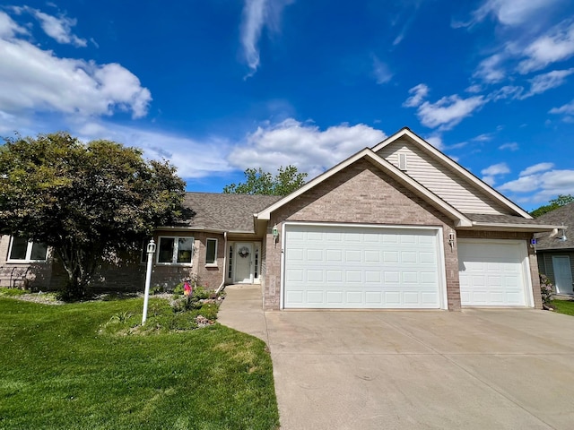 964 Aurora Cir, Red Wing, MN 55066 - single story home featuring brick siding, a garage, concrete driveway, a front yard, and a shingled roof