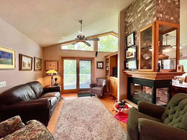 964 Aurora Cir, Red Wing, MN 55066 - living area with a ceiling fan, light wood-type flooring, lofted ceiling, and a textured ceiling