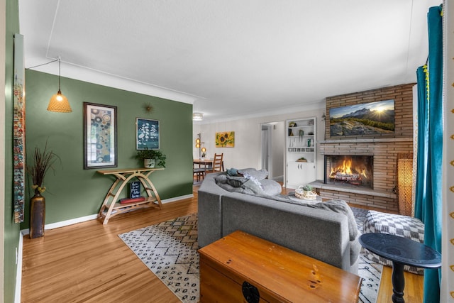 4065 Jersey Ave N, Crystal, MN 55427 - living area with wood finished floors, a brick fireplace, and ornamental molding
