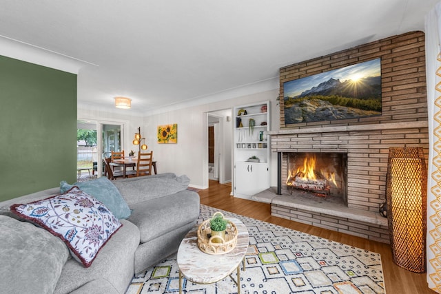 4065 Jersey Ave N, Crystal, MN 55427 - living area with wood finished floors, a fireplace, ornamental molding, and built in features