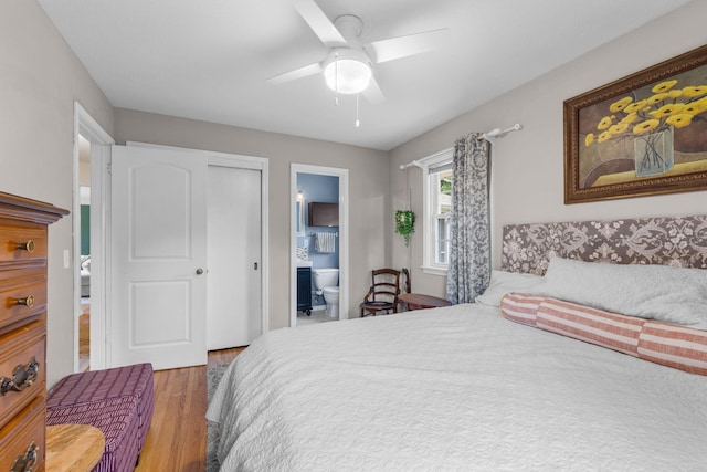 4065 Jersey Ave N, Crystal, MN 55427 - bedroom with wood finished floors, a ceiling fan, and ensuite bathroom