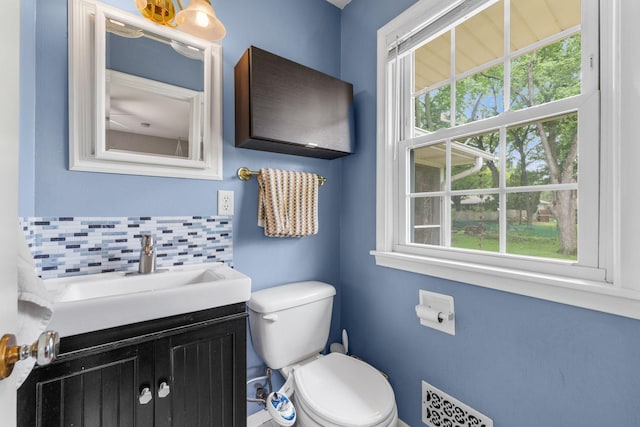 4065 Jersey Ave N, Crystal, MN 55427 - half bath featuring plenty of natural light, vanity, and backsplash