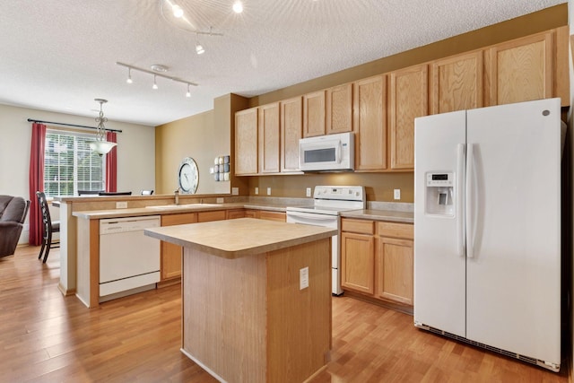 18571 98th Ave N, Maple Grove, MN 55311 - kitchen with white appliances, light brown cabinets, a sink, light countertops, and a peninsula