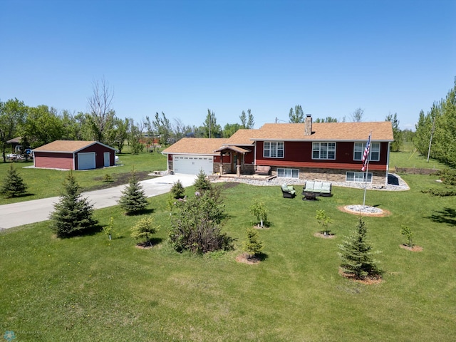 1552 90th Ave N, Moorhead, MN 56560 - view of front of home with a garage, a front yard, and driveway