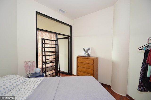 5601 Smetana Dr Unit 518, Minnetonka, MN 55343 - bedroom with baseboards and dark wood-type flooring