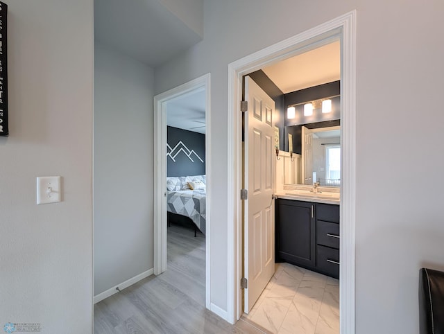 1506 67th Ave S, Fargo, ND 58104 - ensuite bathroom featuring vanity and baseboards