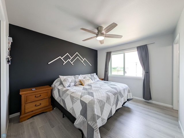 1506 67th Ave S, Fargo, ND 58104 - bedroom with wood finished floors, baseboards, and ceiling fan