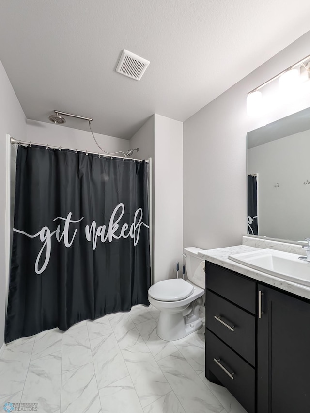 1506 67th Ave S, Fargo, ND 58104 - full bathroom with marble finish floors, vanity, toilet, and curtained shower