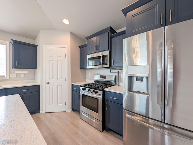 1506 67th Ave S, Fargo, ND 58104 - kitchen with stainless steel appliances, light wood-type flooring, and recessed lighting
