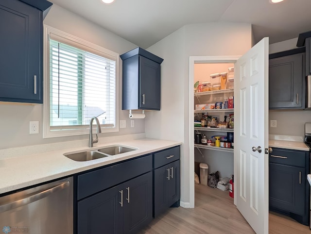 1506 67th Ave S, Fargo, ND 58104 - kitchen with stainless steel dishwasher, a sink, light wood-style flooring, light countertops, and recessed lighting