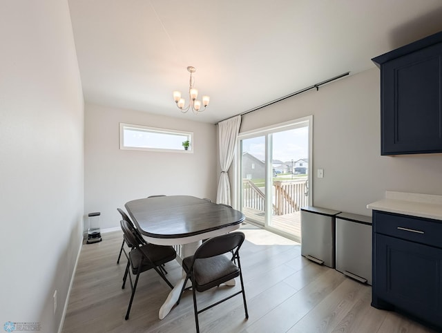 1506 67th Ave S, Fargo, ND 58104 - dining area featuring light wood-style flooring and a chandelier