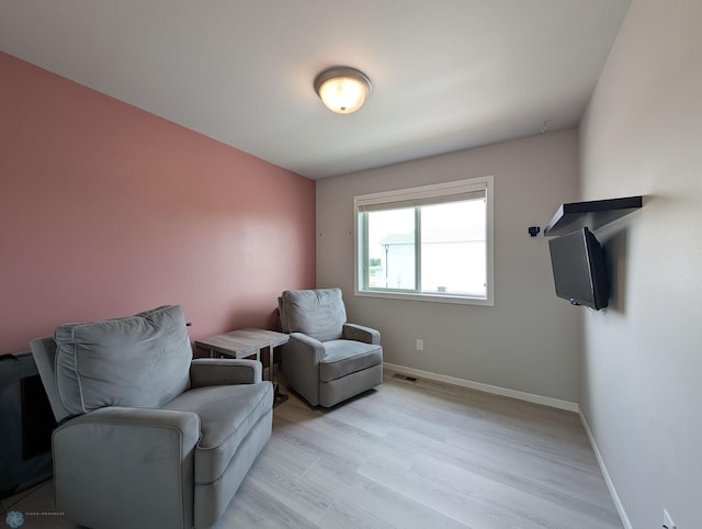 1506 67th Ave S, Fargo, ND 58104 - living area with light wood-style flooring and baseboards