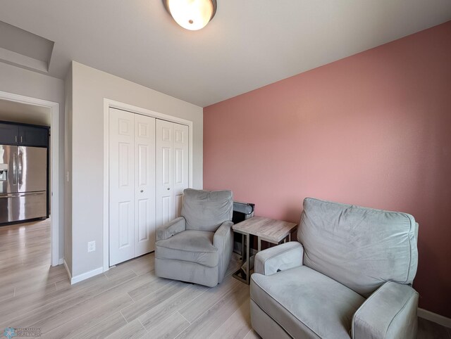 1506 67th Ave S, Fargo, ND 58104 - sitting room featuring light wood-type flooring and baseboards