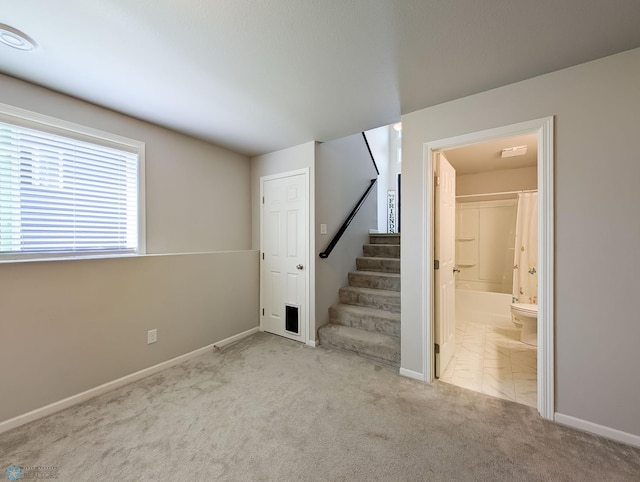 1506 67th Ave S, Fargo, ND 58104 - basement with carpet flooring, stairs, and baseboards