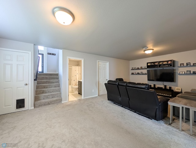 1506 67th Ave S, Fargo, ND 58104 - carpeted living area featuring stairs and baseboards