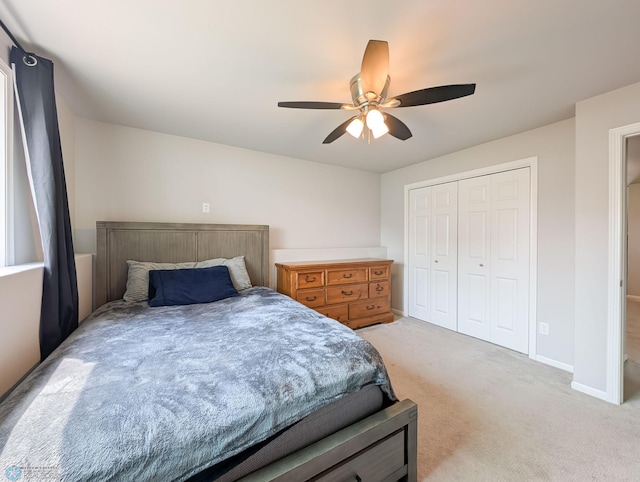 1506 67th Ave S, Fargo, ND 58104 - bedroom with light carpet, a closet, ceiling fan, and baseboards