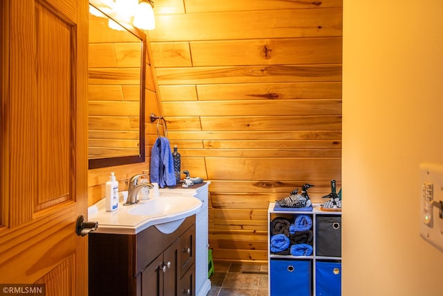 66893 185th Pl, Jacobson, MN 55752 - bathroom featuring vanity and wood walls