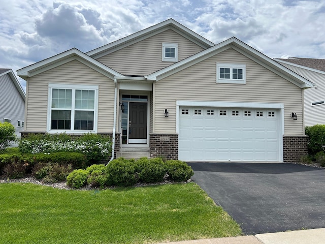 18147 73rd Pl N, Maple Grove, MN 55311 - traditional-style house featuring brick siding, driveway, a front lawn, and a garage
