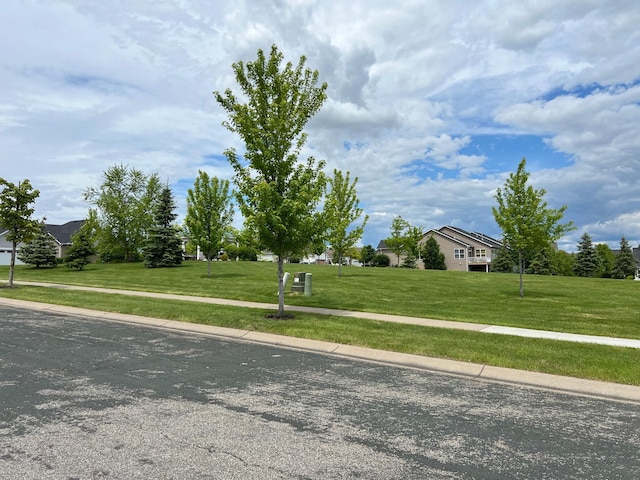 18147 73rd Pl N, Maple Grove, MN 55311 - view of asphalt road with sidewalks and curbs