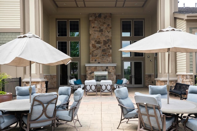 18147 73rd Pl N, Maple Grove, MN 55311 - view of patio with an outdoor stone fireplace and outdoor dining space