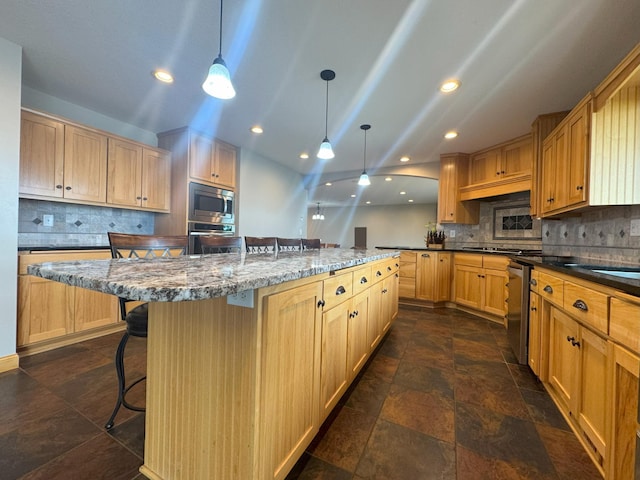 25797 Silver Beach Rd, Minnewaska Twp, MN 56334 - kitchen featuring appliances with stainless steel finishes, a kitchen breakfast bar, backsplash, stone tile flooring, and hanging light fixtures