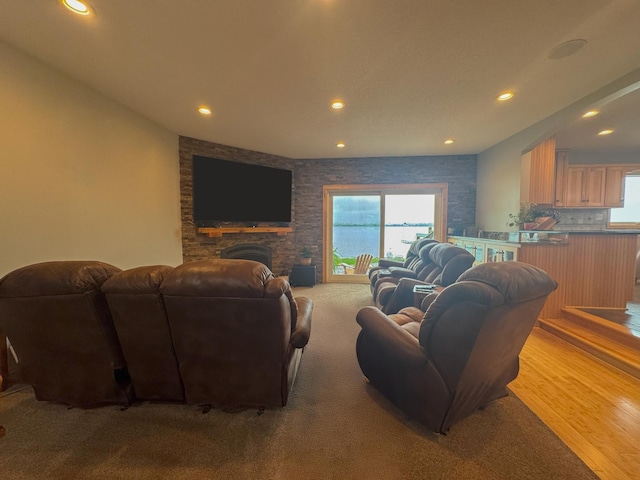 25797 Silver Beach Rd, Minnewaska Twp, MN 56334 - living area featuring recessed lighting, a stone fireplace, and wood finished floors