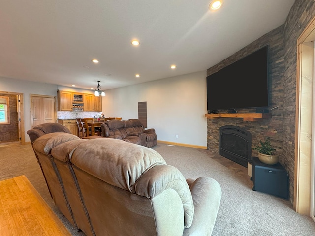 25797 Silver Beach Rd, Minnewaska Twp, MN 56334 - living room featuring light colored carpet, recessed lighting, a fireplace, and baseboards