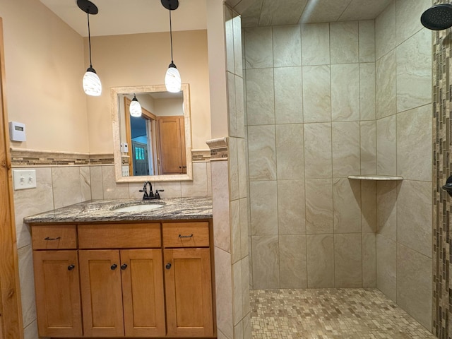 25797 Silver Beach Rd, Minnewaska Twp, MN 56334 - full bathroom featuring tiled shower, vanity, tile walls, and wainscoting