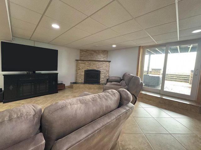 25797 Silver Beach Rd, Minnewaska Twp, MN 56334 - living area with a paneled ceiling, a fireplace, tile patterned floors, and recessed lighting