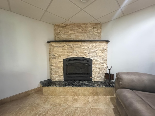 25797 Silver Beach Rd, Minnewaska Twp, MN 56334 - detailed view of a drop ceiling, a fireplace with raised hearth, and baseboards