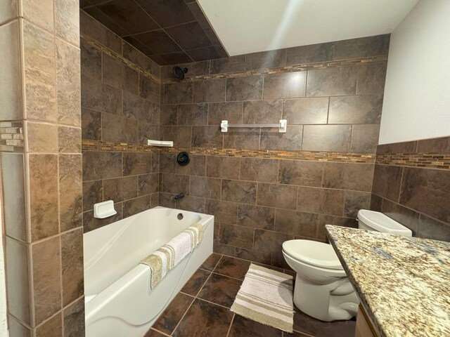 25797 Silver Beach Rd, Minnewaska Twp, MN 56334 - full bathroom featuring tile walls, vanity, toilet, tile patterned floors, and washtub / shower combination