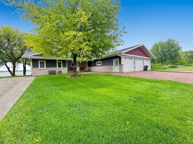 25797 Silver Beach Rd, Minnewaska Twp, MN 56334 - view of front of house featuring stone siding, a front lawn, driveway, and a garage