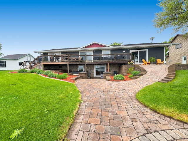 25797 Silver Beach Rd, Minnewaska Twp, MN 56334 - back of house with a wooden deck, a lawn, and stone siding