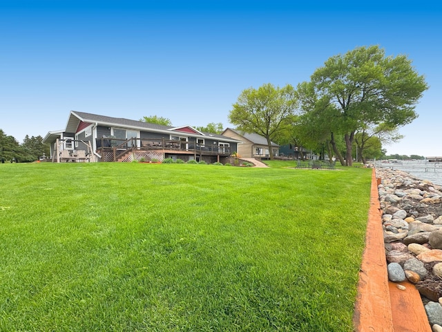 25797 Silver Beach Rd, Minnewaska Twp, MN 56334 - view of green lawn with a deck